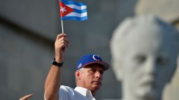 Cuban President Miguel Diaz-Canel waves a national flag during the May Day rally at Revolution Square in Havana on May 1, 2018. (Photo by Yamil LAGE / AFP)        (Photo credit should read YAMIL LAGE/AFP/Getty Images)
