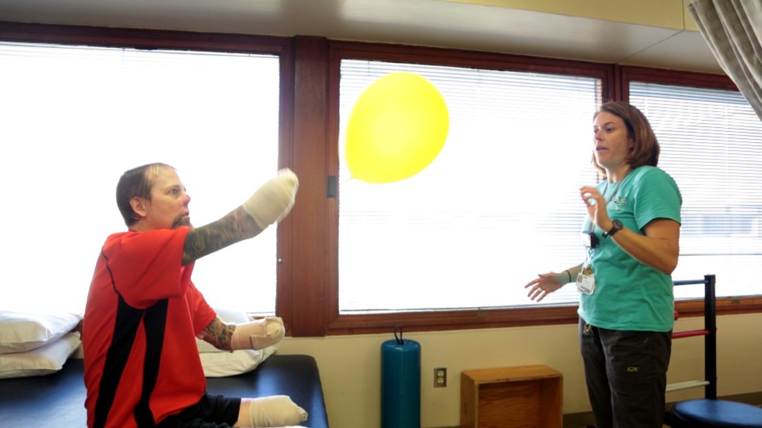 Physical therapist Cheryl Vorwald helps Greg Manteufel with his rehabilitation at Froedtert Hospital.