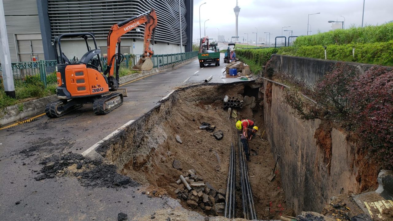 A sinkhole on Macau's Avenue dos Jogos da Asia Oriental, which opened up following heavy rain from Typhoon Mangkhut.