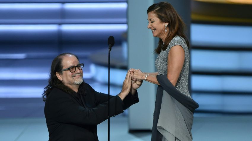 Glenn Weiss (L), winner of the Outstanding Directing for a Variety Special award for 'The Oscars,' proposes marriage to Jan Svendsen onstage during the 70th Emmy Awards at the Microsoft Theatre in Los Angeles, California on September 17, 2018. (Photo by Robyn BECK / AFP)        (Photo credit should read ROBYN BECK/AFP/Getty Images)