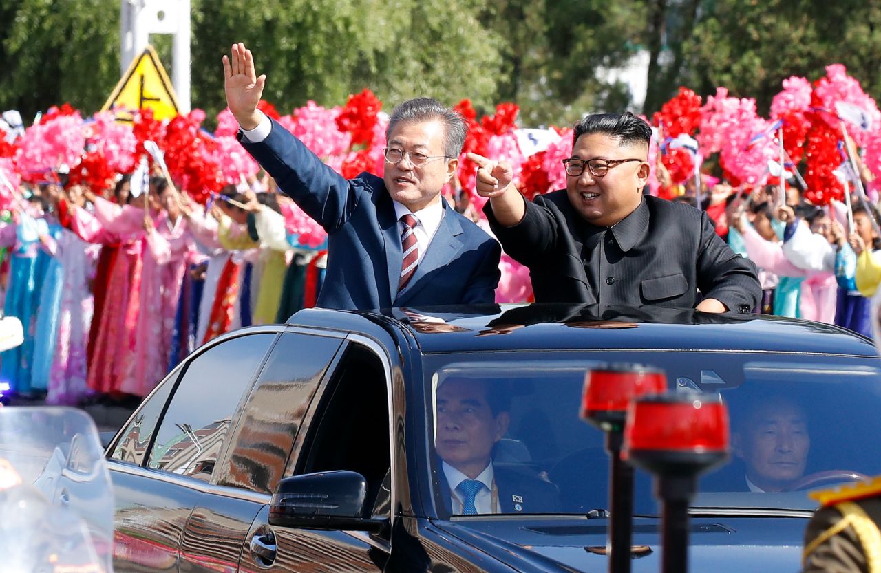 South Korean President Moon Jae-in and North Korean leader Kim Jong Un ride in a parade in Pyongyang, North Korea, on Tuesday, September 18.