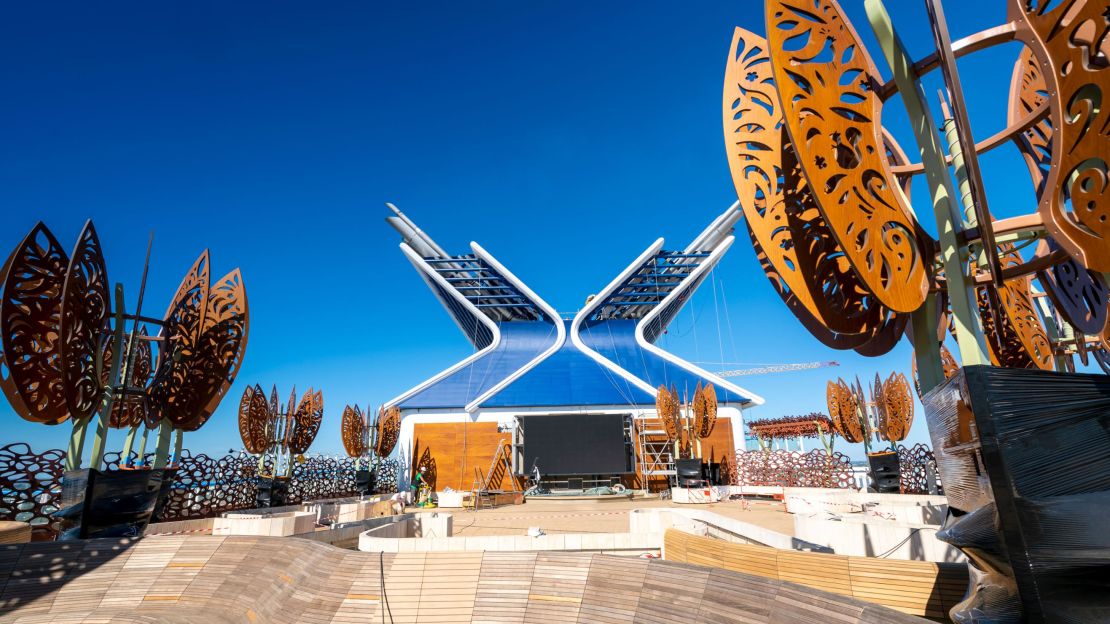 The top deck forms a rooftop garden with interesting sculptures.