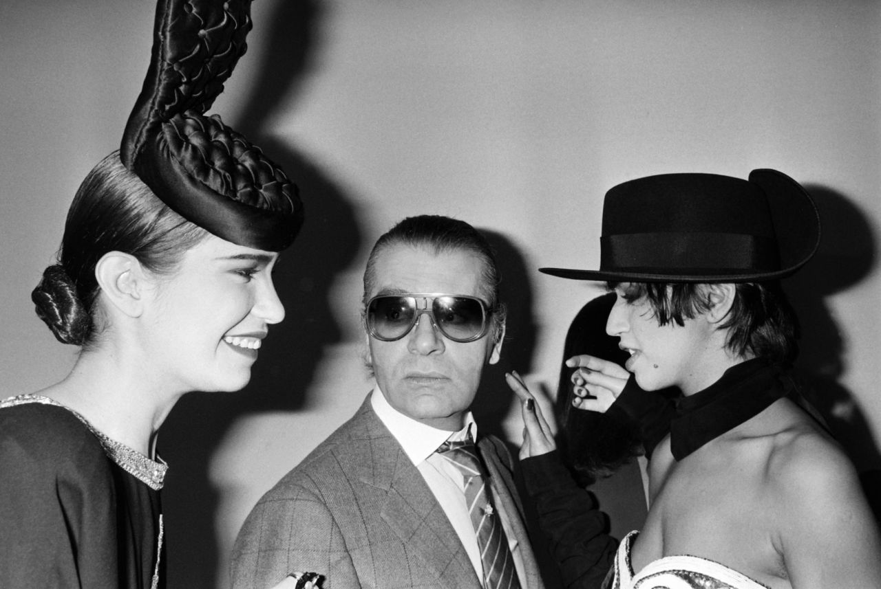 Lagerfeld poses with models after the Chanel Autumn-Winter 1985 show.