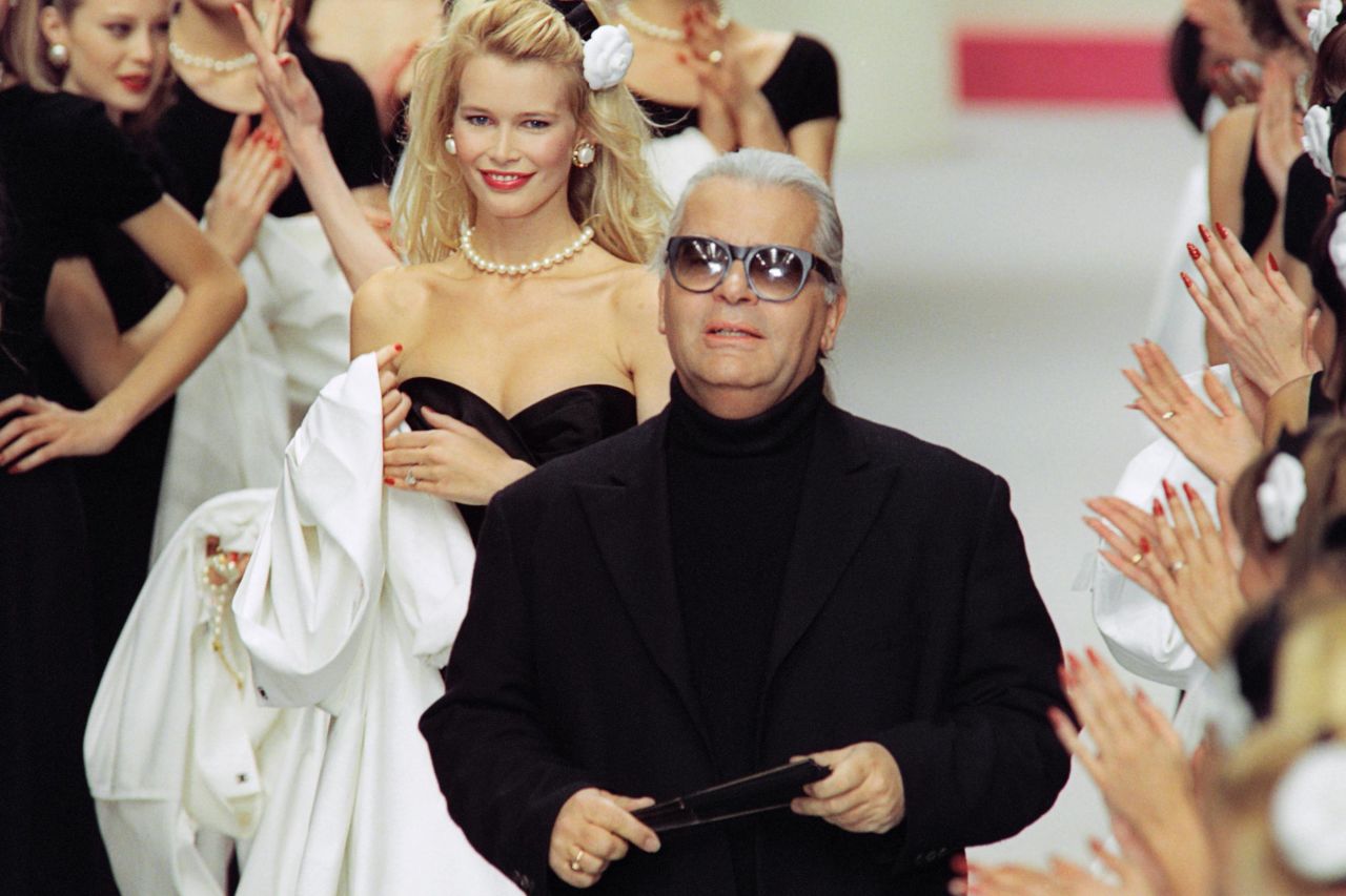 Karl Lagerfeld, followed by German model Claudia Schiffer, at Chanel's Autumn-Winter 1995 show.