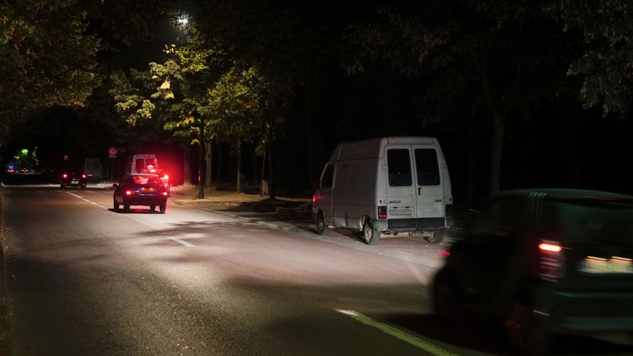 By night, prostitutes work from vans parked at the roadside in the park.