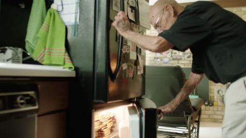 Bob Williams keeps hundreds of chocolate bars in his freezer so that he can give them out to people each day.