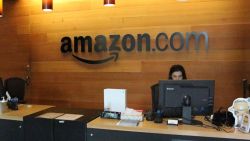 Nikol Szymul staffs a reception desk at Amazon offices discretely tucked into a building called Fiona in downtown Seattle, Washington on May 11, 2017. 
Online retail powerhouse Amazon is constructing an eye-catching Spheres office building to feature waterfalls, tropical gardens and other links to nature as part of its urban campus in Seattle, Washington.  / AFP PHOTO / Glenn CHAPMAN        (Photo credit should read GLENN CHAPMAN/AFP/Getty Images)