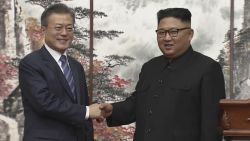 In this image made from video provided by Korea Broadcasting System (KBS), North Korean leader Kim Jong Un, right, and South Korean President Moon Jae-in shake hands at the end of their joint press conference in Pyongyang, North Korea Wednesday, September 19, 2018.