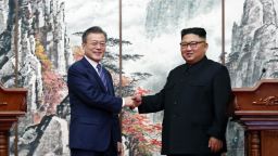 PYONGYANG, NORTH KOREA - SEPTEMBER 19: (EDITORIAL USE ONLY, NO COMMERCIAL USE) South Korean President Moon Jae-in (L) ashakes hands with North Korean leader Kim Jong Un (R) during a joint press conference at Paekhwawon State Guesthouse on September 19, 2018 in Pyongyang, North Korea. Kim and Moon meet for the Inter-Korean summit talks after the 1945 division of the peninsula, and will discuss ways to denuclearize the Korean Peninsula. (Photo by Pyeongyang Press Corps/Pool/Getty Images)