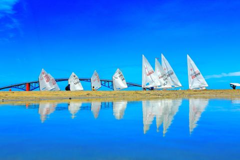 During the Taiwan Regatta on Penghu Island, Lien Shou Lin photographed sails and their reflections, as the boats gathered at the starting line.