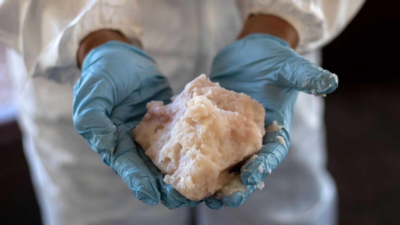 A Mexican Army expert shows crystal meth paste at a clandestine laboratory near la Rumorosa town in Tecate, Baja California state, Mexico on August 28, 2018. - According to the Army, the lab can produce up to 200 kilograms of the crystal meth daily. On the same operation the Army destroyed two marihuana plantations with a total surface area of 19,000 square meters. (Photo by Guillermo Arias / AFP)        (Photo credit should read GUILLERMO ARIAS/AFP/Getty Images)