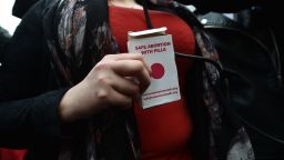 BELFAST, NORTHERN IRELAND - MAY 31: An unindentified woman displays an abortion pill packet after taking one of the pills as abortion rights campaign group ROSA, Reproductive Rights Against Oppression, Sexism and Austerity distribute abortion pills from a touring bus on May 31, 2018 in Belfast, Northern Ireland. Flouting Northern Irish governmental laws which forbid the use of abortion pills the group are also protesting outside offices belonging to the main political parties in the province. Women in Northern Ireland have been prosecuted for buying abortion pills over the internet and it is illegal for a woman to have an abortion unless in special circumstances unlike the rest of the United Kingdom. The Republic of Ireland voted in favour of pro-choice last week in a referendum. (Photo by Charles McQuillan/Getty Images)