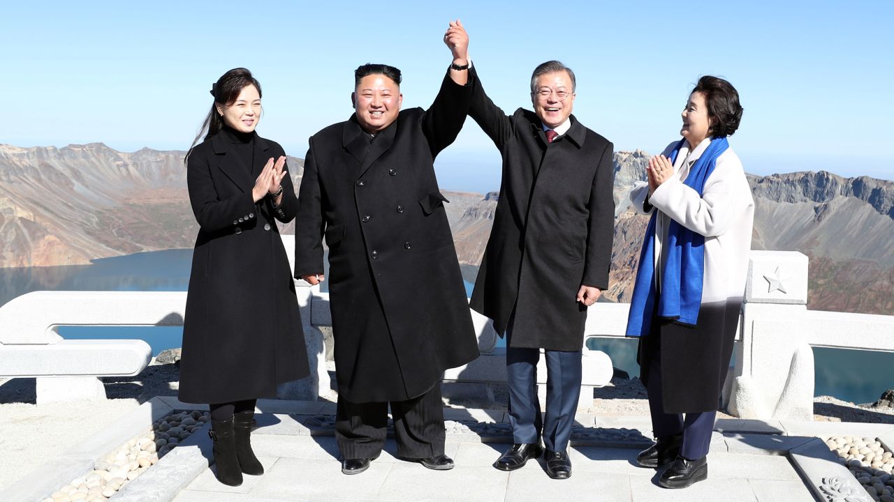 North Korean leader Kim Jong Un and his wife Ri Sol Ju pose with South Korean President Moon Jae-in and his wife Kim Jung-sook on the top of Mount Paektu in North Korea on Thursday, September 20.