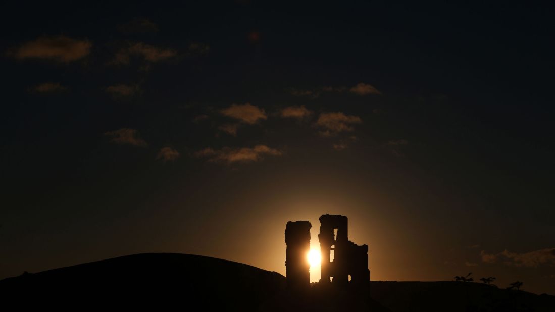 <strong>Dorset, England:</strong> The sun rises behind Corfe Castle, not far from the English Channel.