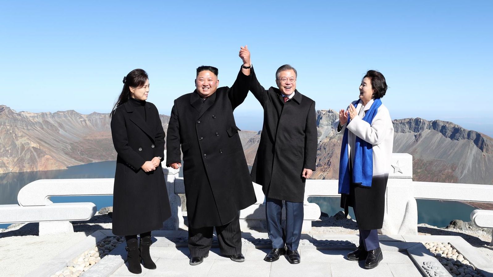 A handout photo shows South Korean President Moon Jae-in and North Korean leader Kim Jong Un visiting Mount Paektu.