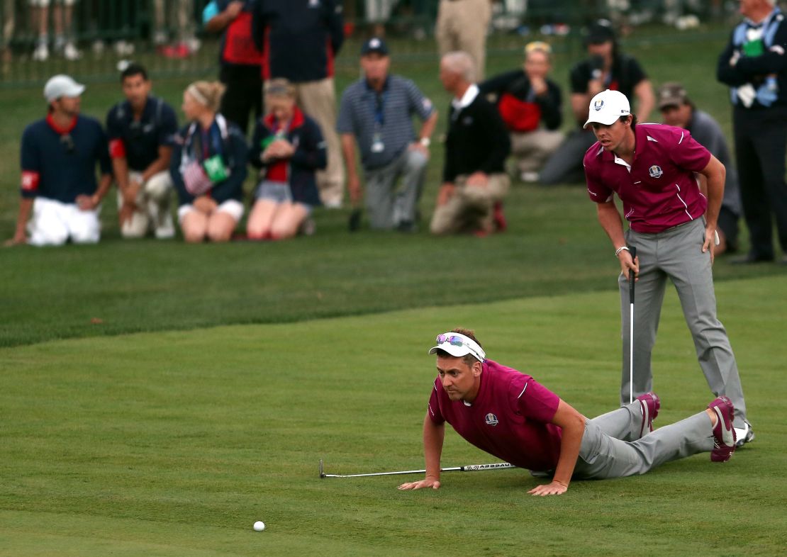 Poulter and McIlroy fighting hard in 2012 Ryder Cup at Medinah. 