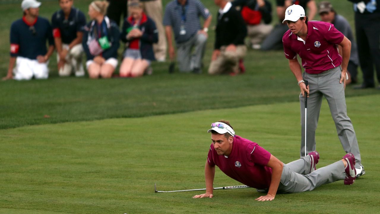 Poulter and McIlroy fighting hard in 2012 Ryder Cup at Medinah. 