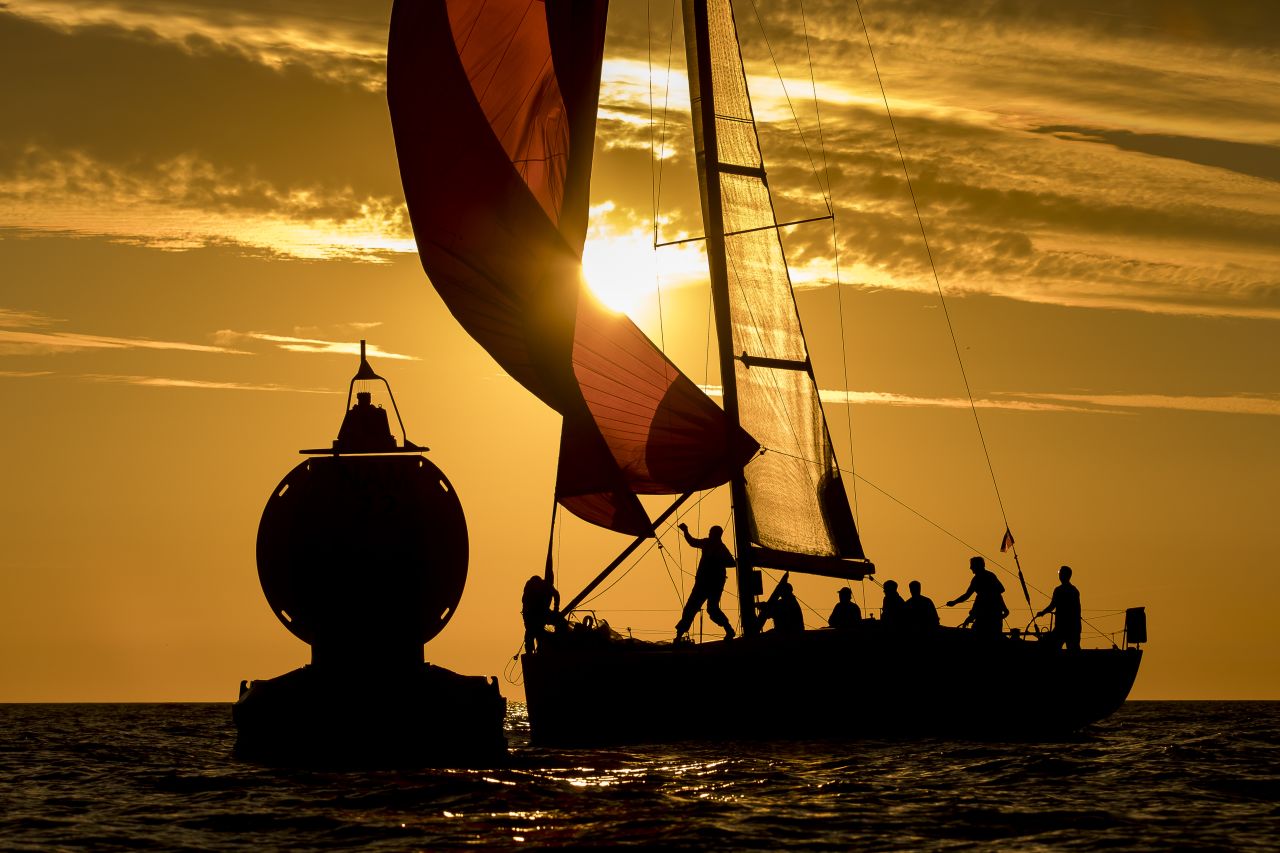 Sander Van der Borch photographed the silhouetted crew of Xenia preparing to turn the boat  around the mark during the Hague Offshore Worlds race.