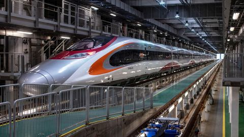 A Guangzhou-Shenzhen-Hong Kong Express Rail Link 'Vibrant Express' train is seen at Shek Kong Stabling Sidings in Hong Kong on August 16, 2018. - The high-speed connection out of the harbourfront West Kowloon station will link Hong Kong to the southern Chinese city of Guangzhou 80 miles (130 km) away and then onto China's national rail network. (Photo by Philip FONG / AFP)        (Photo credit should read PHILIP FONG/AFP/Getty Images)