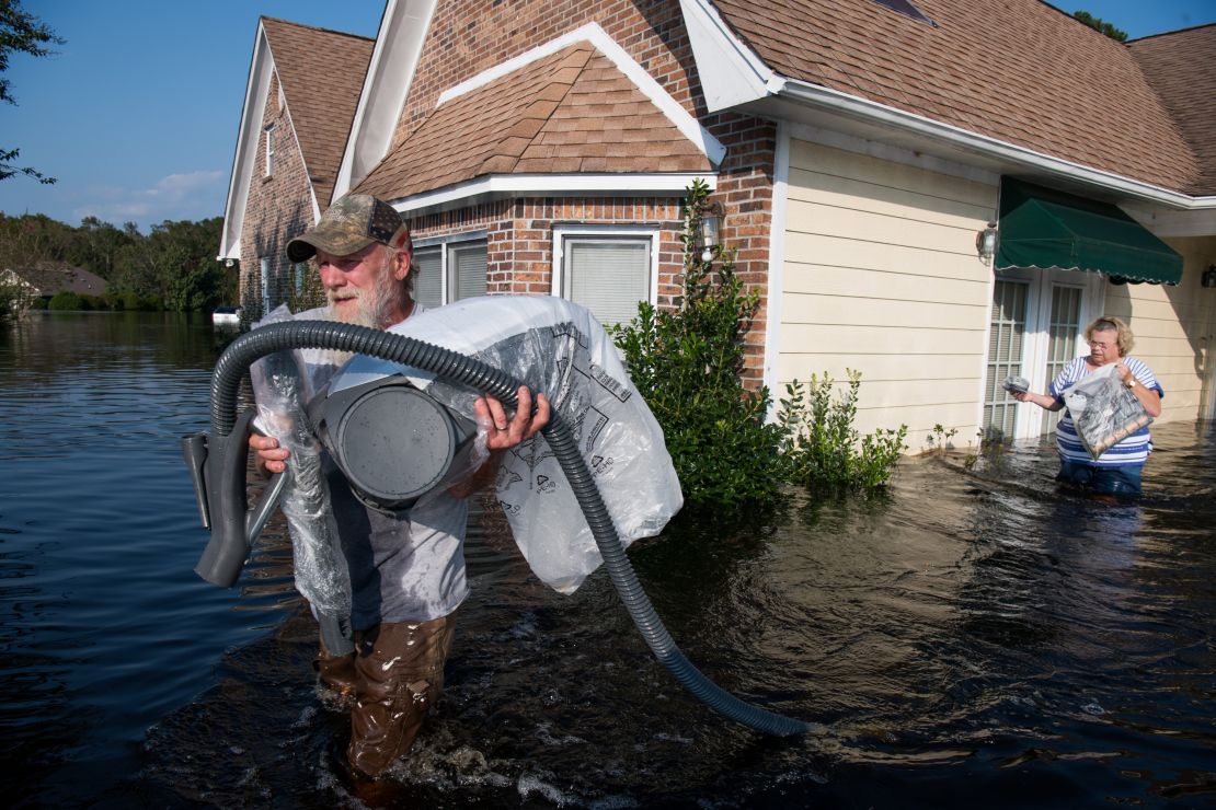 Authorities urged residents to stay away from their homes but some have returned to collect some belongings.