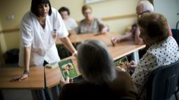 BARCELONA, SPAIN - AUGUST 02:  An elderly woman holds a picture of a sheep as she try to remenber the name of the animal during a memory activity at the Cuidem La Memoria elderly home, which specializes in Alzheimer patients on August 2, 2012 in Barcelona, Spain. 
