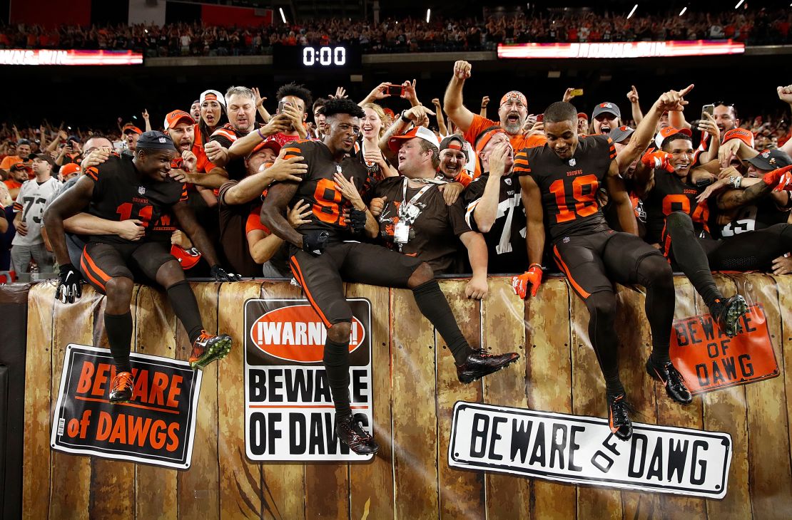 Cleveland Browns' players celebrate with their fans after Thursday's win.