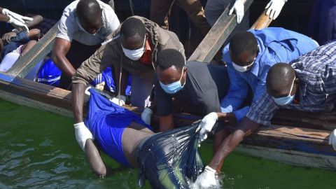 Rescuers retrieve a body Friday from the water near Ukara Island on Lake Victoria in Tanzania. 