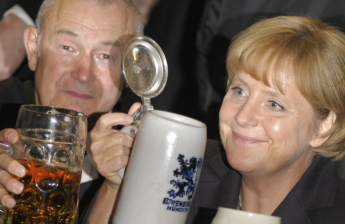 Bavaria's State Premier Guenther Beckstein toasts with Angela Merkel during the Berlin version "Oktoberfest" in 2008