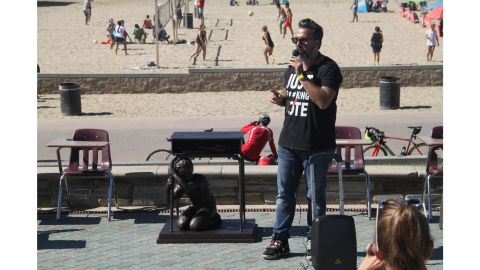 Manuel Oliver stands with his creation.