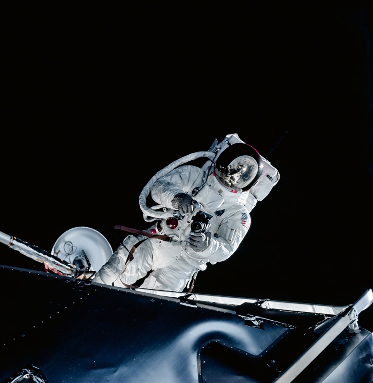 Image shows Lunar Module Pilot Russell Schweickart taking a photograph during his Extravehicular Activity (EVA) testing the new spacesuit during the Apollo 9 mission.