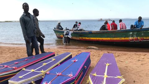Volunteers arrange the coffins of passengers killed when the ferry capsized.