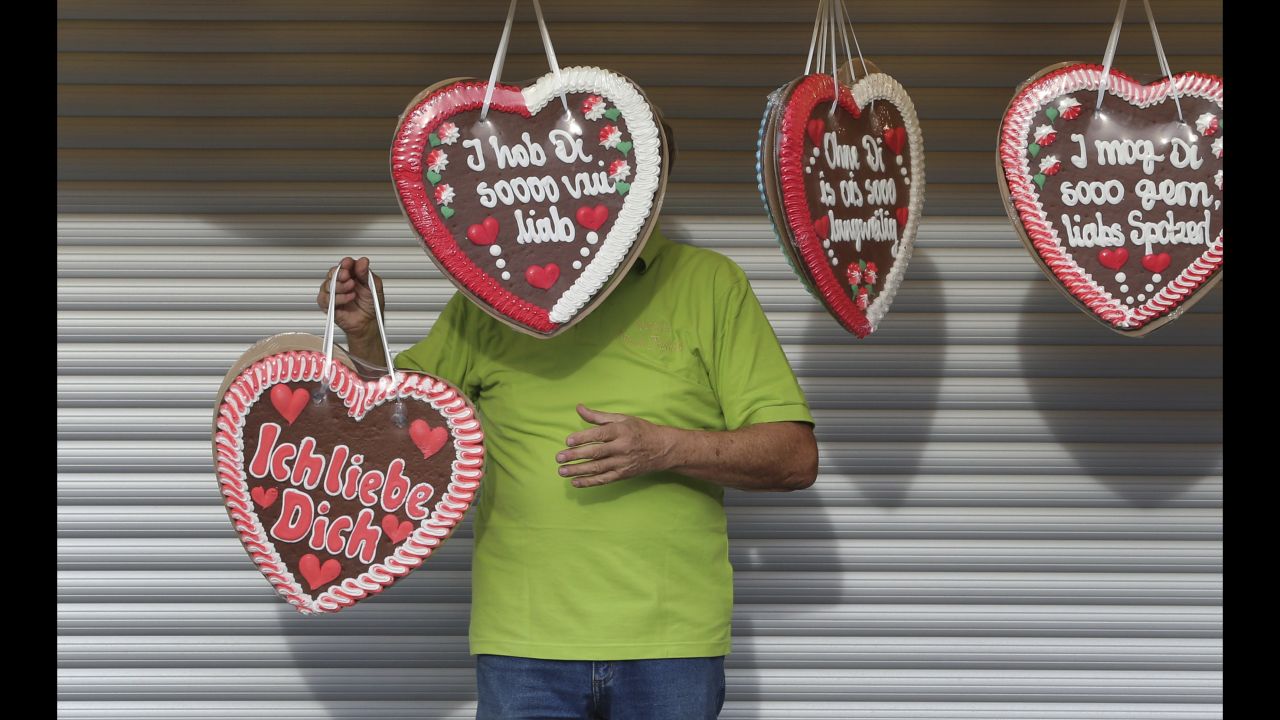 A gingerbread heart seller decorates his stand at Oktoberfest in Munich on September 22.