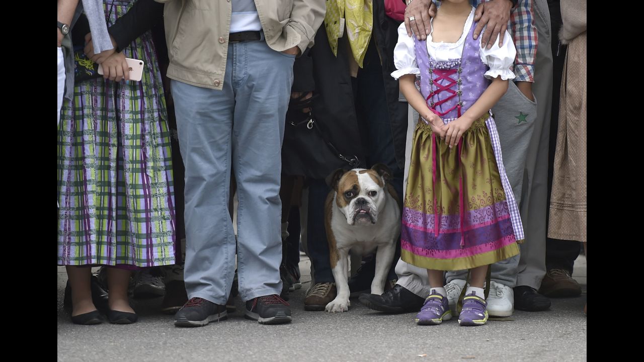 Oktoberfest visitors watch the participants go by in the opening day parade on September 22.