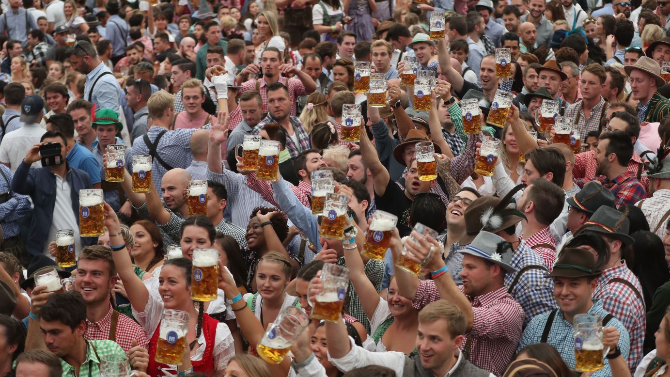 Visitors celebrate in a beer tent on the opening day of Oktoberfest on September 22.
