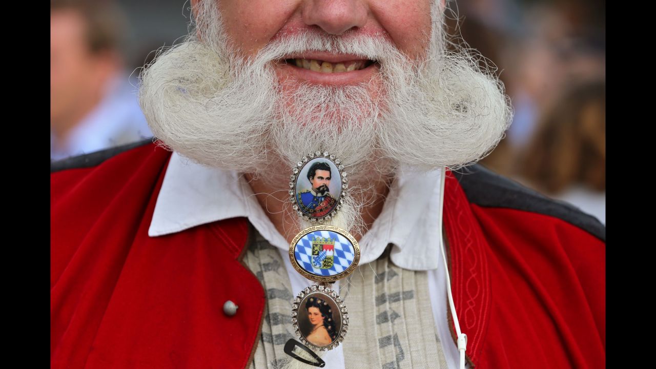 A visitor has his beard decorated at the opening day of Oktoberfest on September 22. The festival celebrates traditional German clothing as well as food and beer.