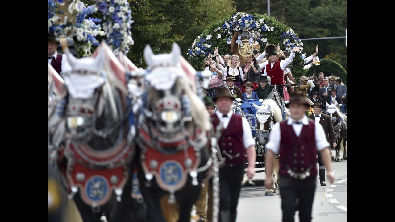Decorated horses pull carriages and wagons in a parade as the festival innkeepers move in on September 22.