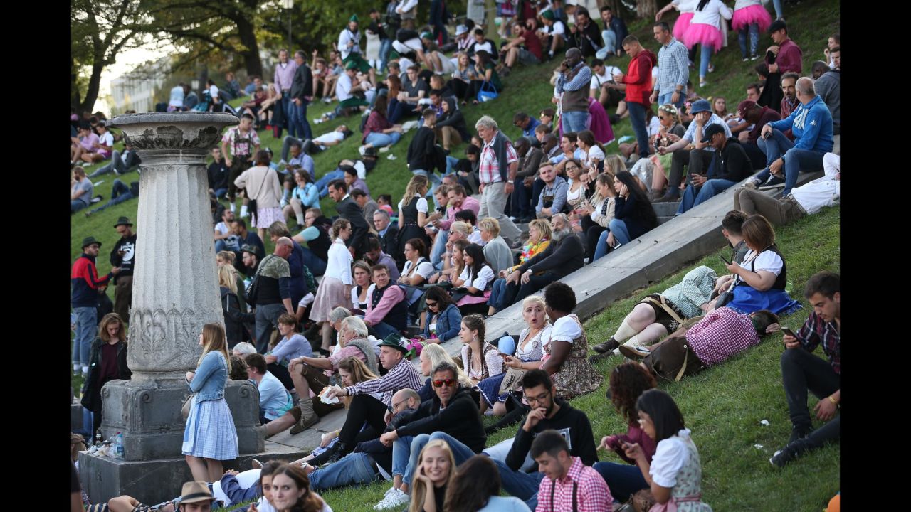 Revelers relax outside on the opening day of Oktoberfest on September 22.