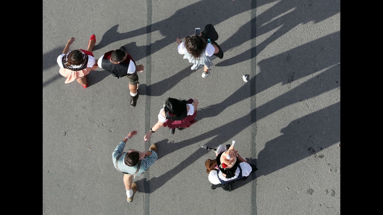 Visitors walk through Oktoberfest in Munich on Saturday, September 22.