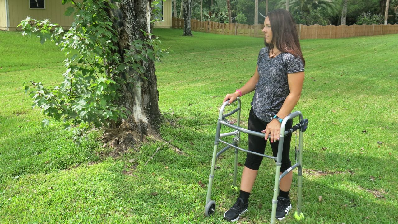 Thomas stands next to the red maple where the truck she was driving came to a halt. "The stimulator is facilitating my movement," she says, "but my strength is coming from within."