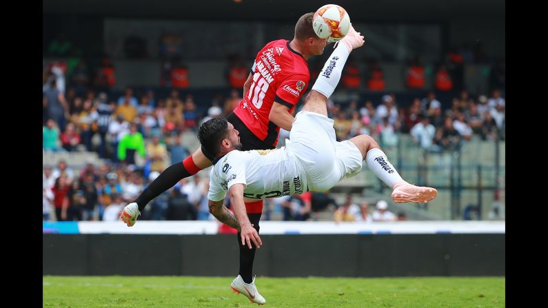 Alan Mendoza of Pumas UNAM struggles for the ball with Abraham Gonzalez of Lobos BUAP during their match in the Torneo Apertura Liga MX on Sunday, September 16, in Mexico City. Pumas won 4-2.