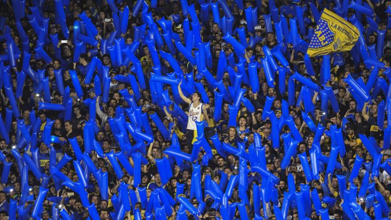 Fans of Argentina's Boca Juniors cheer during the Copa Libertadores quarterfinal soccer match in Buenos Aires on Wednesday, September 19.