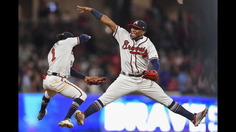 Ozzie Albies and Ronald Acuna Jr. of the Atlanta Braves celebrate after defeating the Philadelphia Phillies on Friday, September 21, in Atlanta.