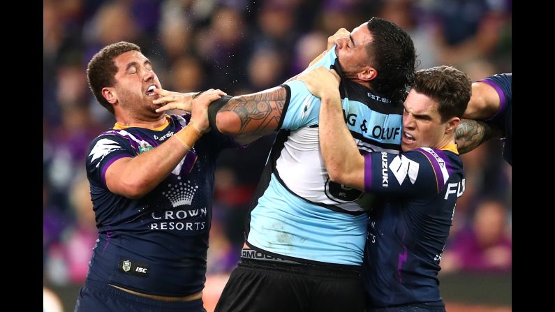 Kenny Bromwich of the Melbourne Storm and Andrew Fifita of the Cronulla Sharks have an altercation during the NRL Preliminary Final match on Friday, September 21, in Melbourne.
