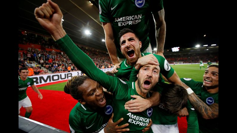 Glenn Murray of Brighton and Hove Albion celebrates with his teammates after scoring their second goal against Southampton on Monday, September 17, in Southampton, England.
