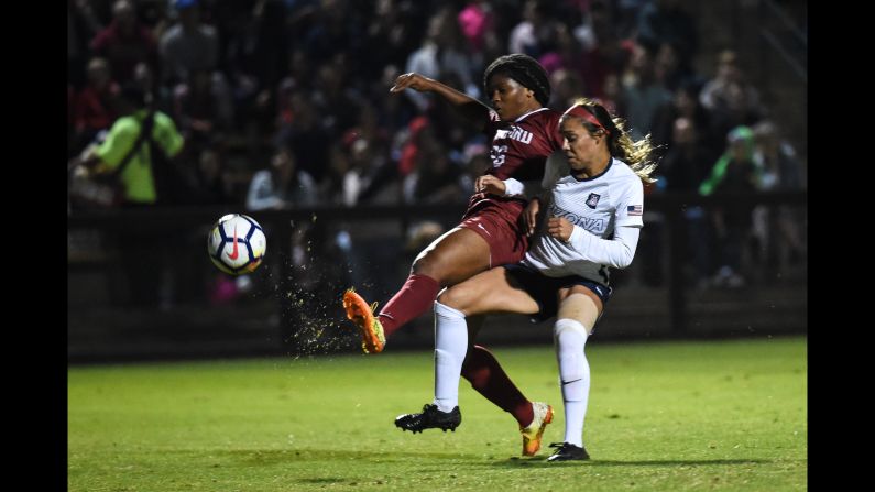 Madison Haley of Stanford University fights for the ball with Sabrina Enciso of The University of Arizona in the women's soccer match Friday, September 21, in Stanford, California.