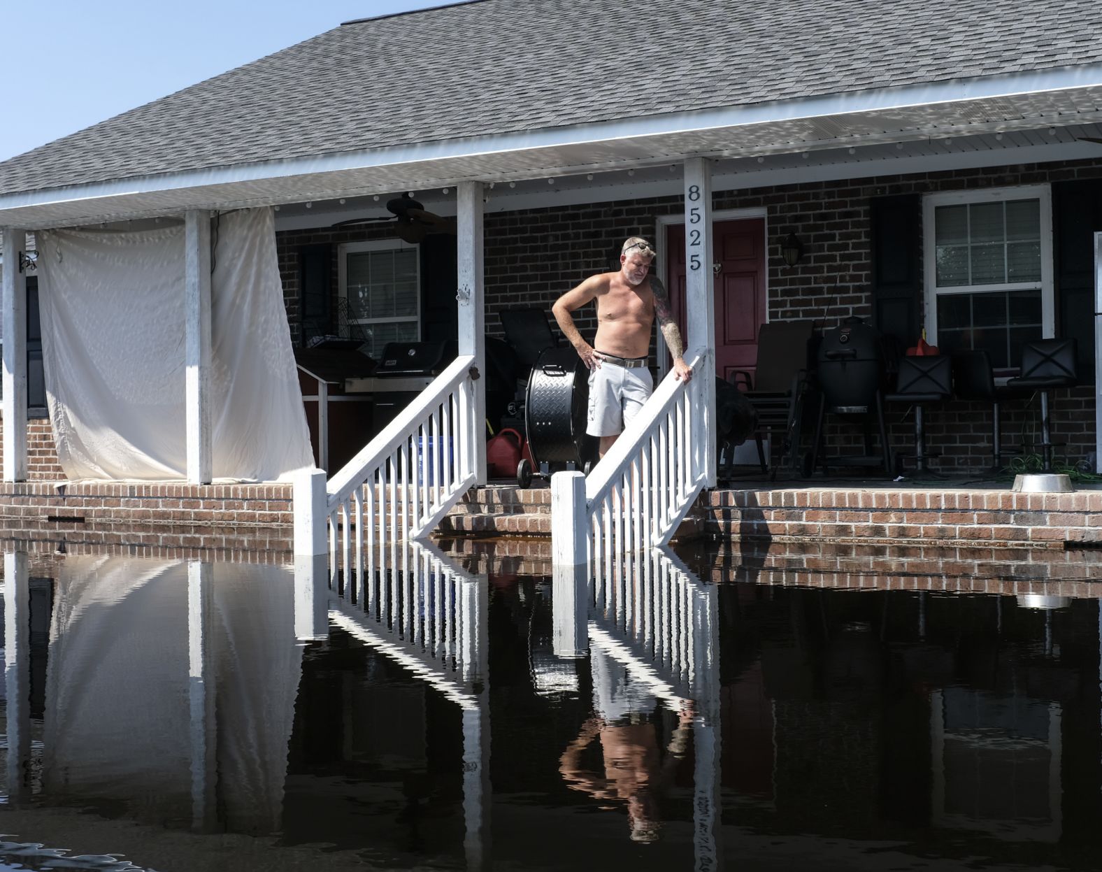 Brian Terry looks at the floodwaters outside his home in Brittons Neck, South Carolina, on Saturday, September 22.