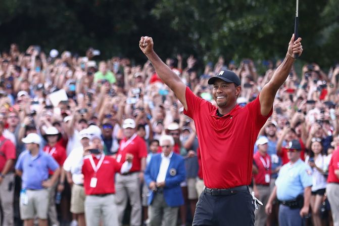 Tiger Woods celebrates after <a href="index.php?page=&url=https%3A%2F%2Fwww.cnn.com%2F2018%2F09%2F23%2Fgolf%2Ftiger-woods-tour-championship-spt-intl%2Findex.html">winning the PGA Tour Championship</a> at East Lake Golf Club in Atlanta on Sunday, September 23.