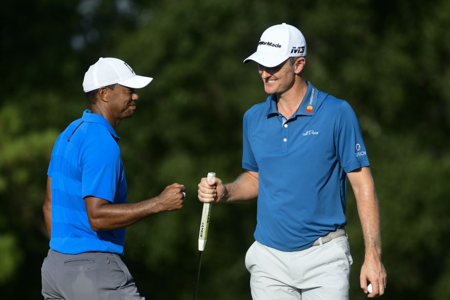 Woods and Justin Rose fist-bump on the 16th green during the third round Saturday, September 22.