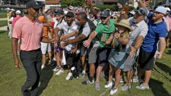 ATLANTA, GA - SEPTEMBER 20: Tiger Woods fist bumps with fans after leaving the 18t hole during the first round of the TOUR Championship at East Lake Golf Club on September 20, 2018, in Atlanta, Georgia. (Photo by Stan Badz/PGA TOUR)