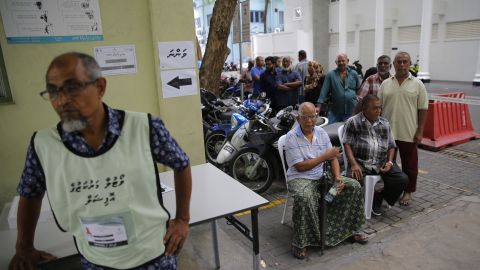 Maldivians queue to vote in the capital Male.